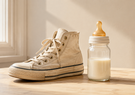 A vintage sneaker and a baby bottle placed side by side in bright light, visualizing the piece's comparison between identity-driven markets across life stages